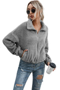 Chaqueta teddy con cremallera y dobladillo con cordón